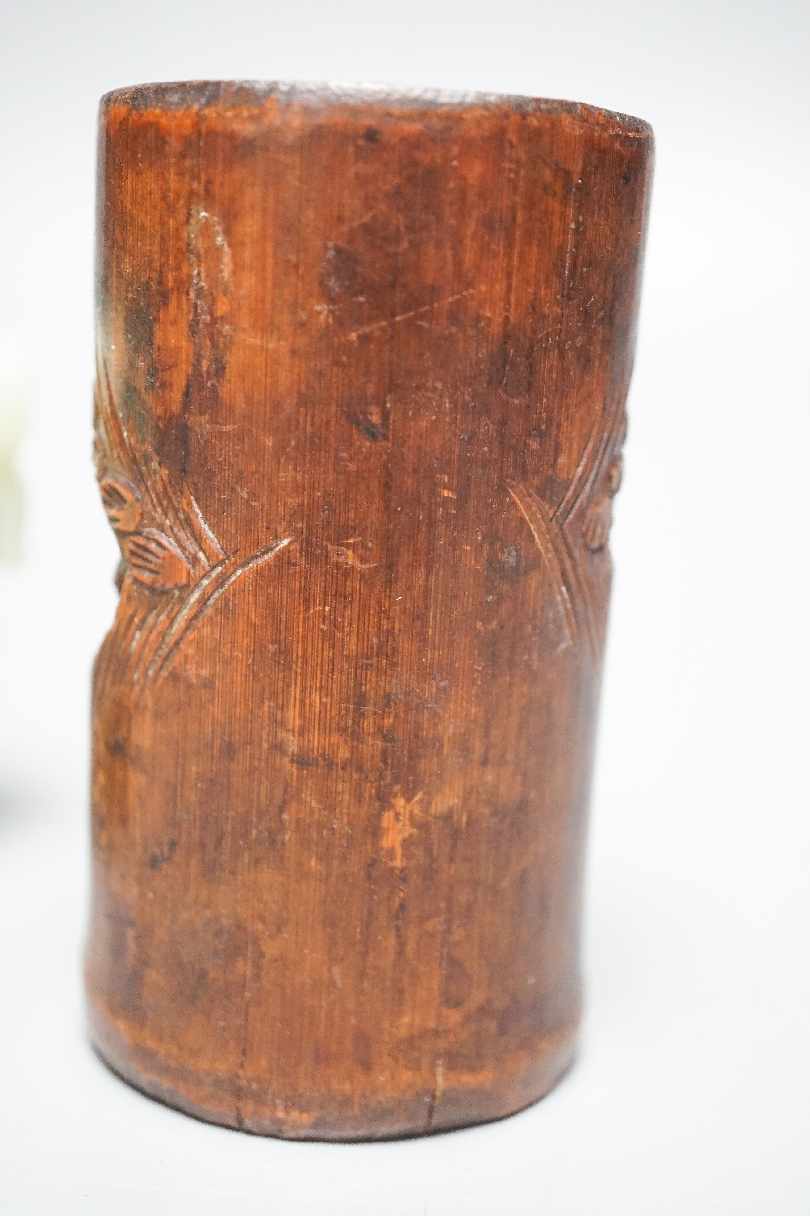 A Chinese bowenite jade tripod censer, 17cm wide, a Chinese green glazed ‘duck’ water dropper and a small bamboo brush part, 19th/20th century (3)
